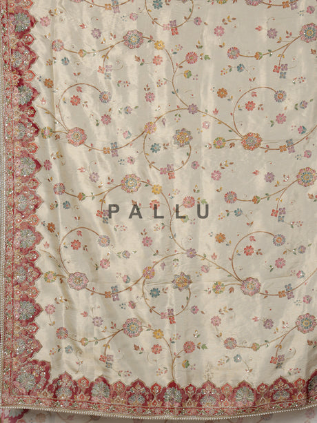 Cream pashmina saree with floral motifs and contrasting embellished border