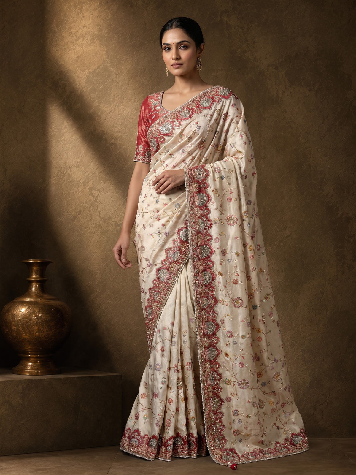 Cream pashmina saree with floral motifs and contrasting embellished border
