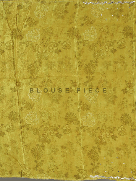 Cream crepe silk saree with checked patterns and floral embellishments