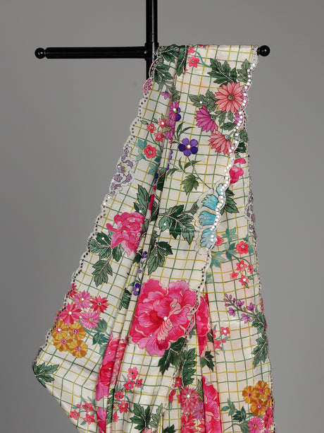 Cream crepe silk saree with checked patterns and floral embellishments