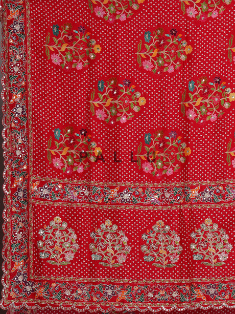 Red muslin silk saree with bandhani print and traditional aabla embellishments