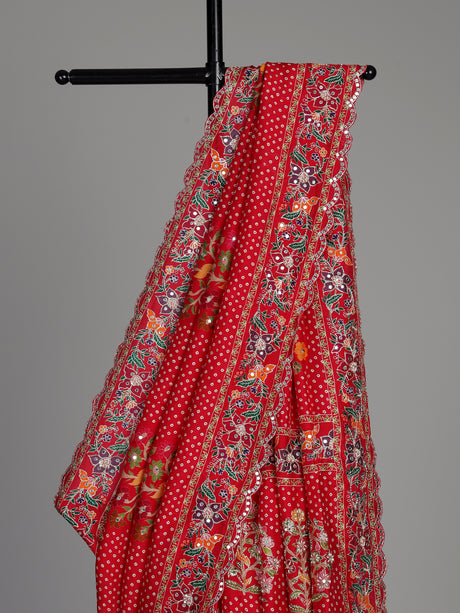 Red muslin silk saree with bandhani print and traditional aabla embellishments