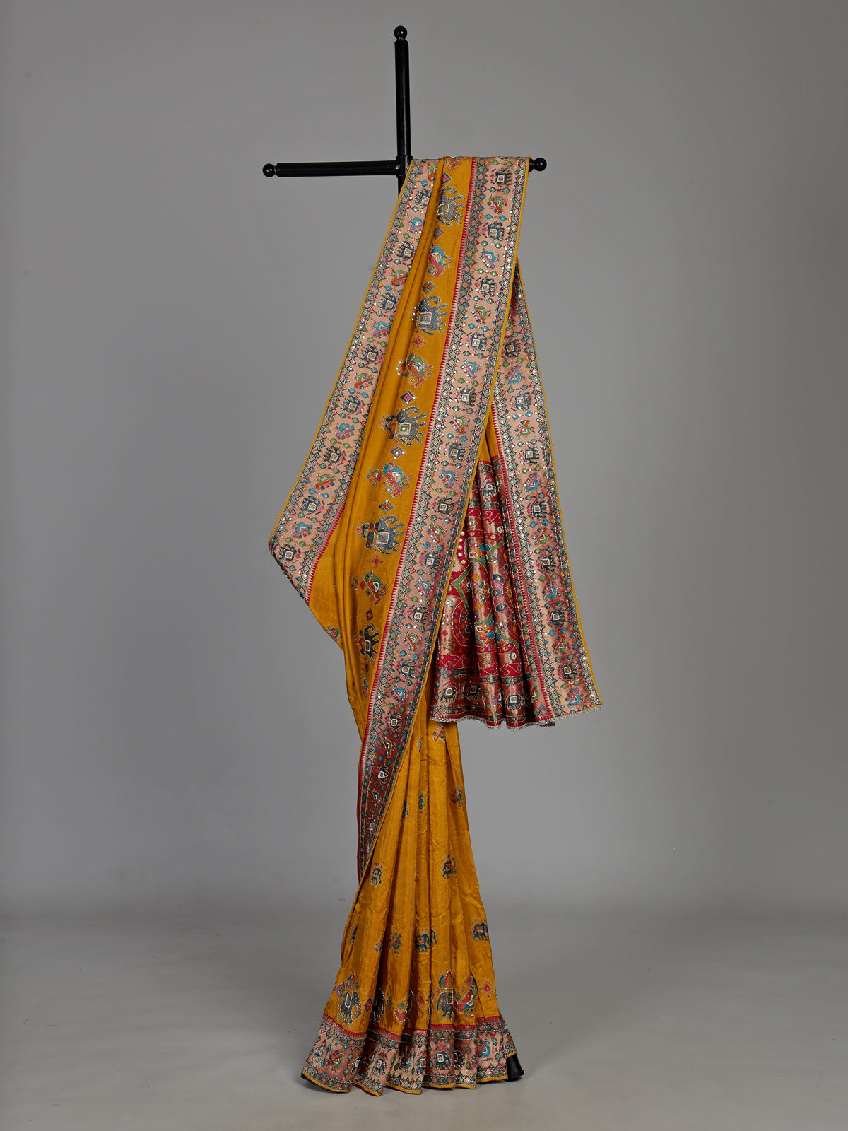 Mustard yellow pashmina saree with elephant motifs and contrasting pallu