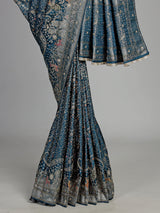 Teal blue semi silk saree with artistic animal and bird motifs