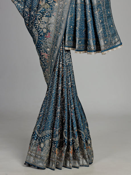 Teal blue semi silk saree with artistic animal and bird motifs