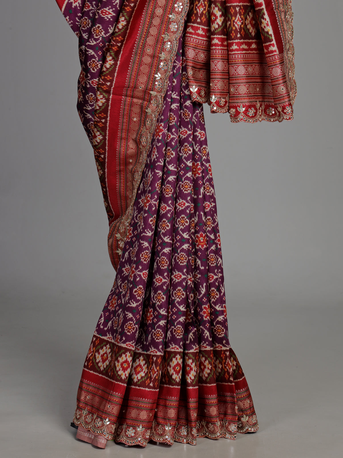 Purple semi patola silk saree with Patola print and contrasting embellished pallu