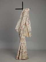 Cream tusser silk saree with floral prints and embellished beadwork