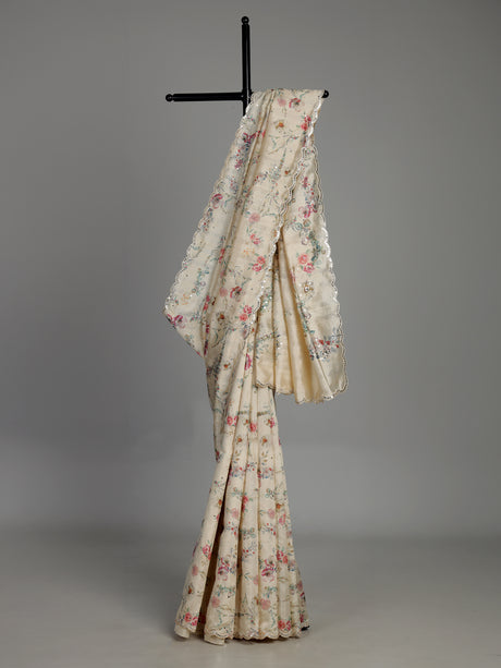 Cream tusser silk saree with floral prints and embellished beadwork