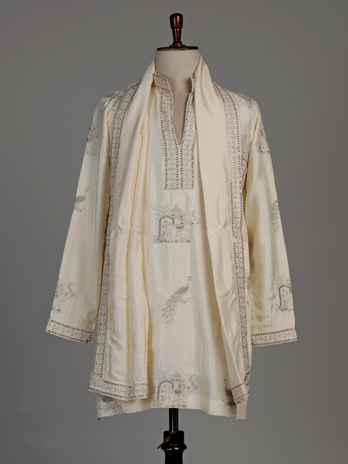 Cream raw silk kurta suit with royal peacock and elephant embroidery for mens