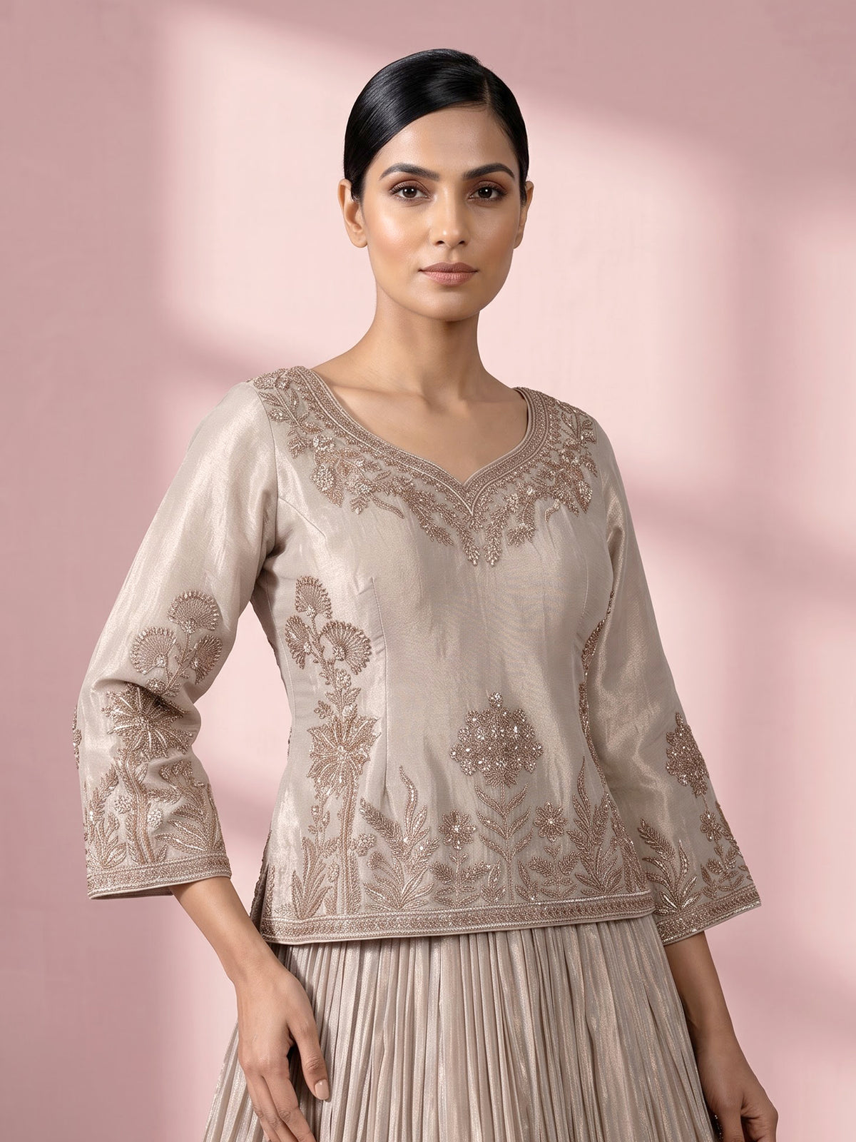 Pastel beige tissue silk lehenga choli with intricate zardosi detailing