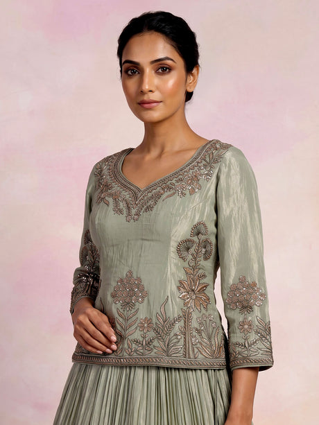 Sage green tissue silk lehenga choli with rajasthani style choli