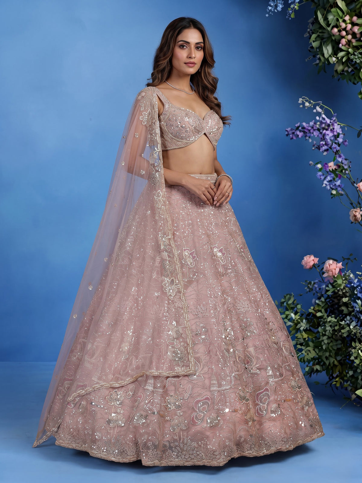 Light pink net lehenga choli with cutdana and sequin embellishments