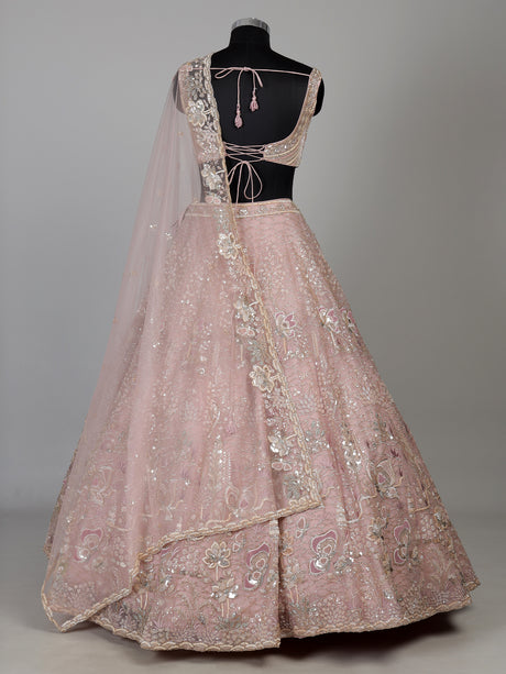 Light pink net lehenga choli with cutdana and sequin embellishments