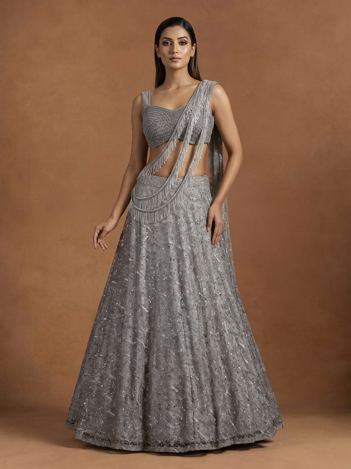 Grey net lehenga choli with pearl embellishments and designer detailing