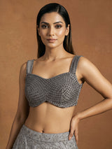 Grey net lehenga choli with pearl embellishments and designer detailing