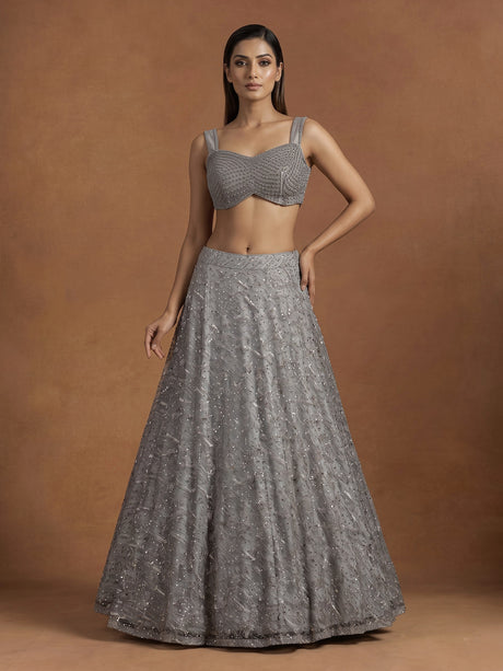 Grey net lehenga choli with pearl embellishments and designer detailing