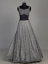 Grey net lehenga choli with pearl embellishments and designer detailing