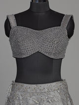 Grey net lehenga choli with pearl embellishments and designer detailing