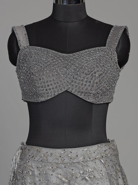 Grey net lehenga choli with pearl embellishments and designer detailing