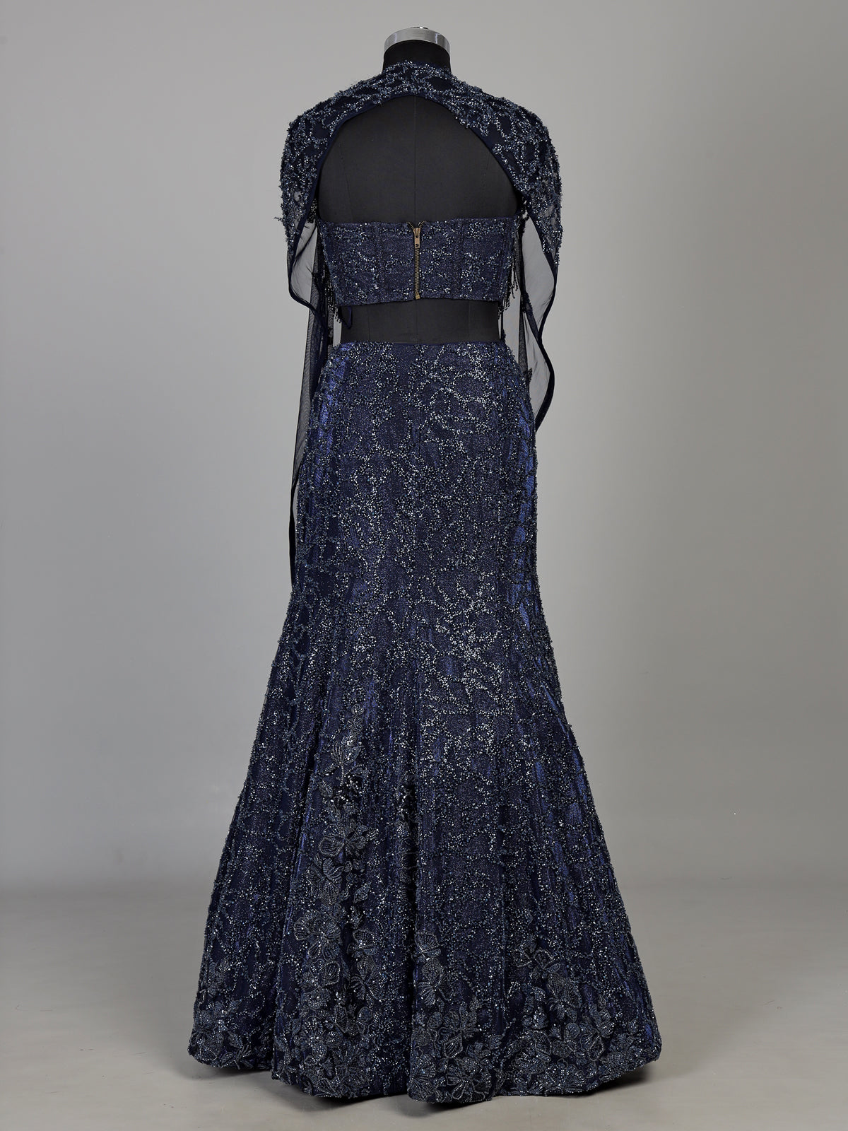 Blue net lehenga choli with designer shrug and zardosi embellishments