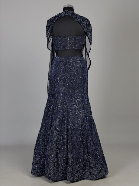 Blue net lehenga choli with designer shrug and zardosi embellishments