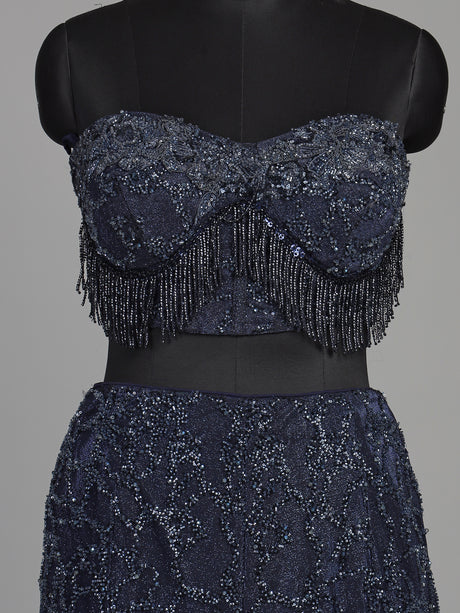 Blue net lehenga choli with designer shrug and zardosi embellishments