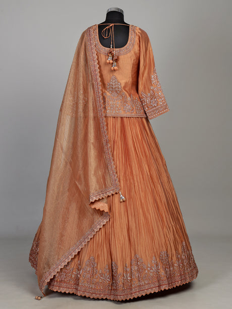 Pastel peach tissue silk lehenga choli with embellished sweetheart neckline