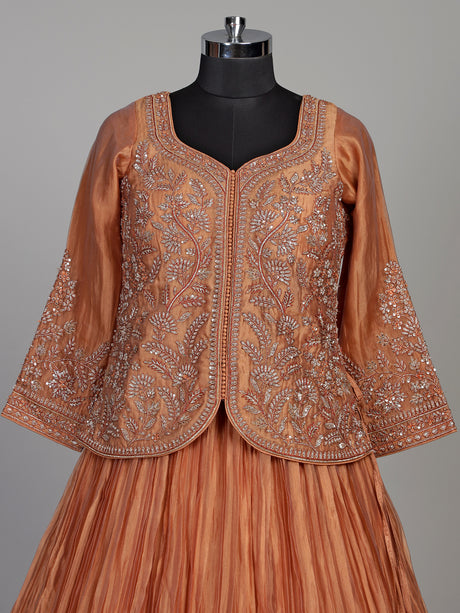 Pastel peach tissue silk lehenga choli with embellished sweetheart neckline