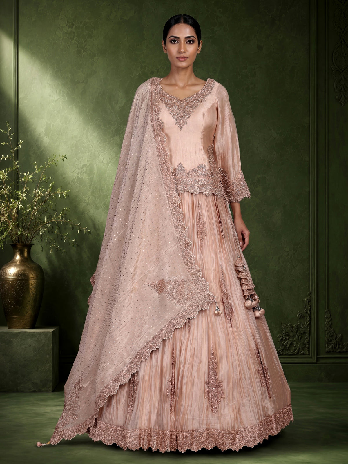 Pastel peach tissue silk lehenga choli with intricate cutdana embellishments