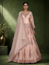 Pastel peach tissue silk lehenga choli with intricate cutdana embellishments