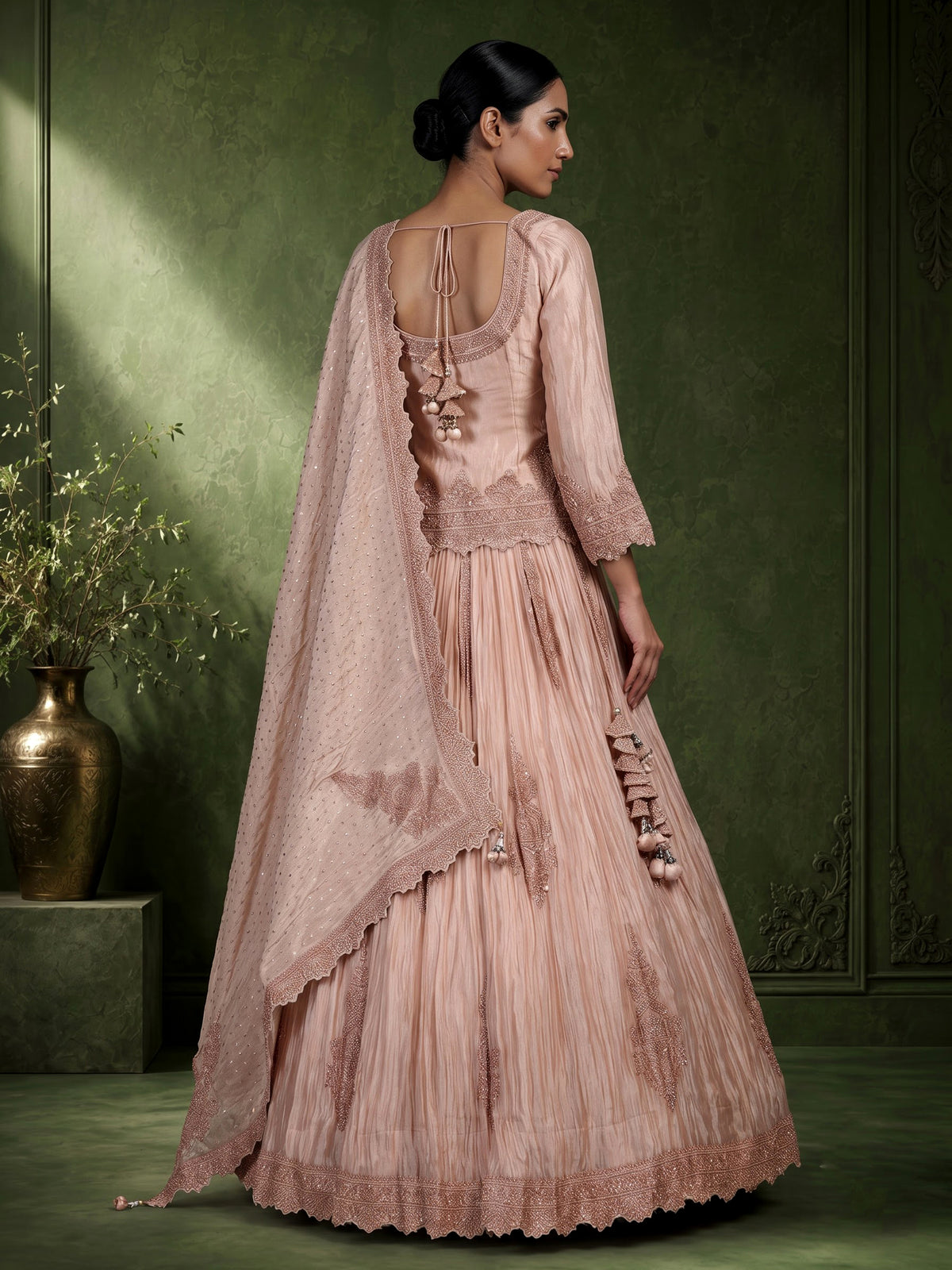 Pastel peach tissue silk lehenga choli with intricate cutdana embellishments