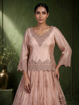 Pastel peach tissue silk lehenga choli with intricate cutdana embellishments
