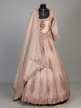 Pastel peach tissue silk lehenga choli with intricate cutdana embellishments