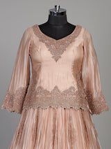 Pastel peach tissue silk lehenga choli with intricate cutdana embellishments