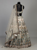 Cream silk printed lehenga choli with intricate zardosi and gota work