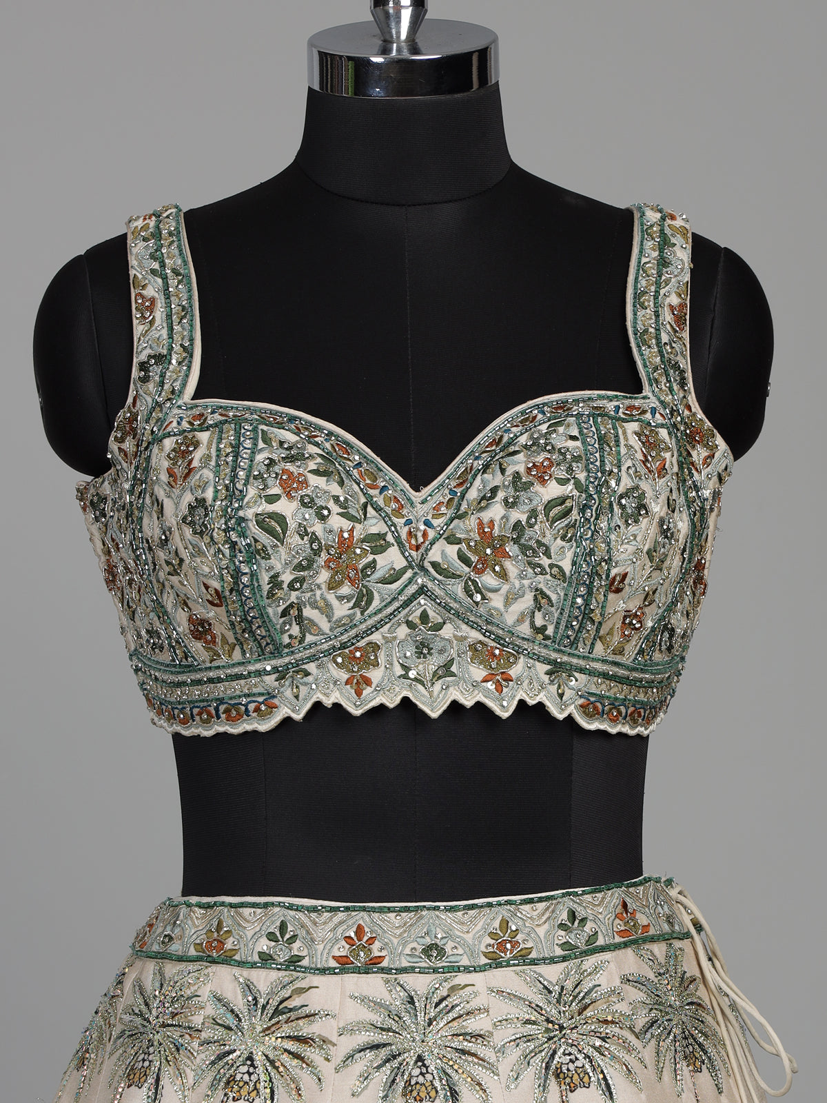 Cream silk printed lehenga choli with intricate zardosi and gota work