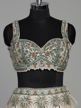 Cream silk printed lehenga choli with intricate zardosi and gota work