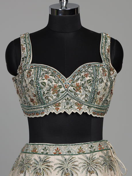 Cream silk printed lehenga choli with intricate zardosi and gota work