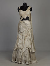 Cream chiffon georgette lehenga choli with pearl and tassel embellishments