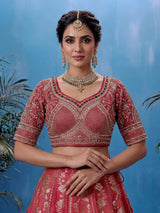 Rani pink silk lehenga choli with ornate floral embroidery