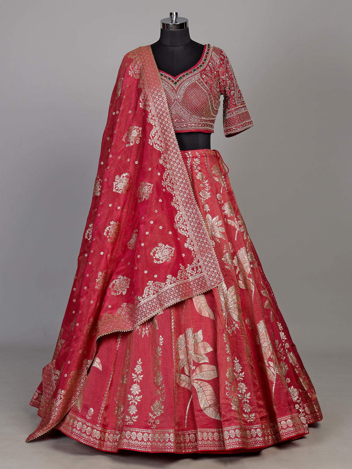 Rani pink silk lehenga choli with ornate floral embroidery