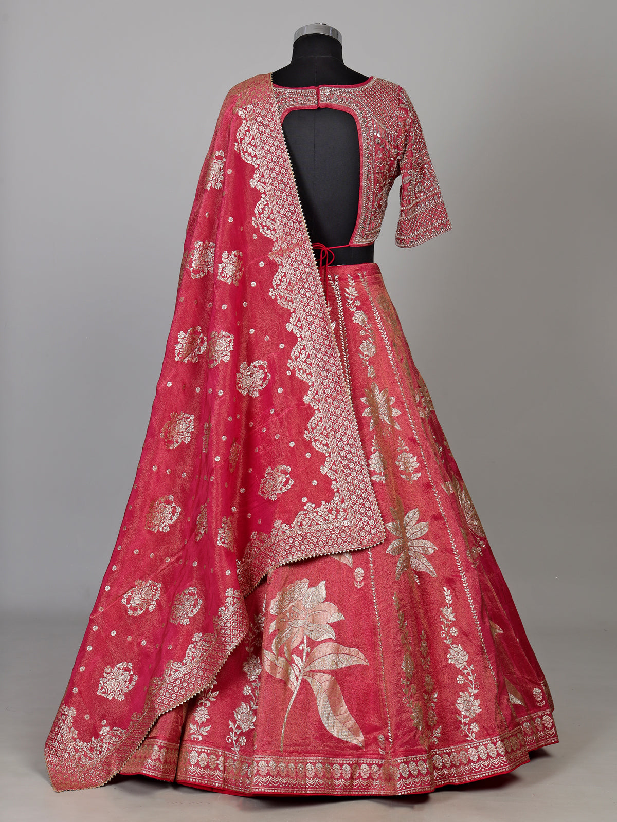 Rani pink silk lehenga choli with ornate floral embroidery