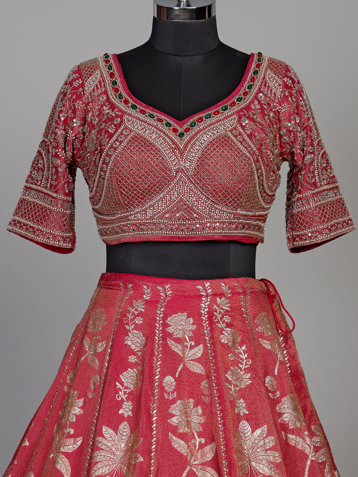 Rani pink silk lehenga choli with ornate floral embroidery