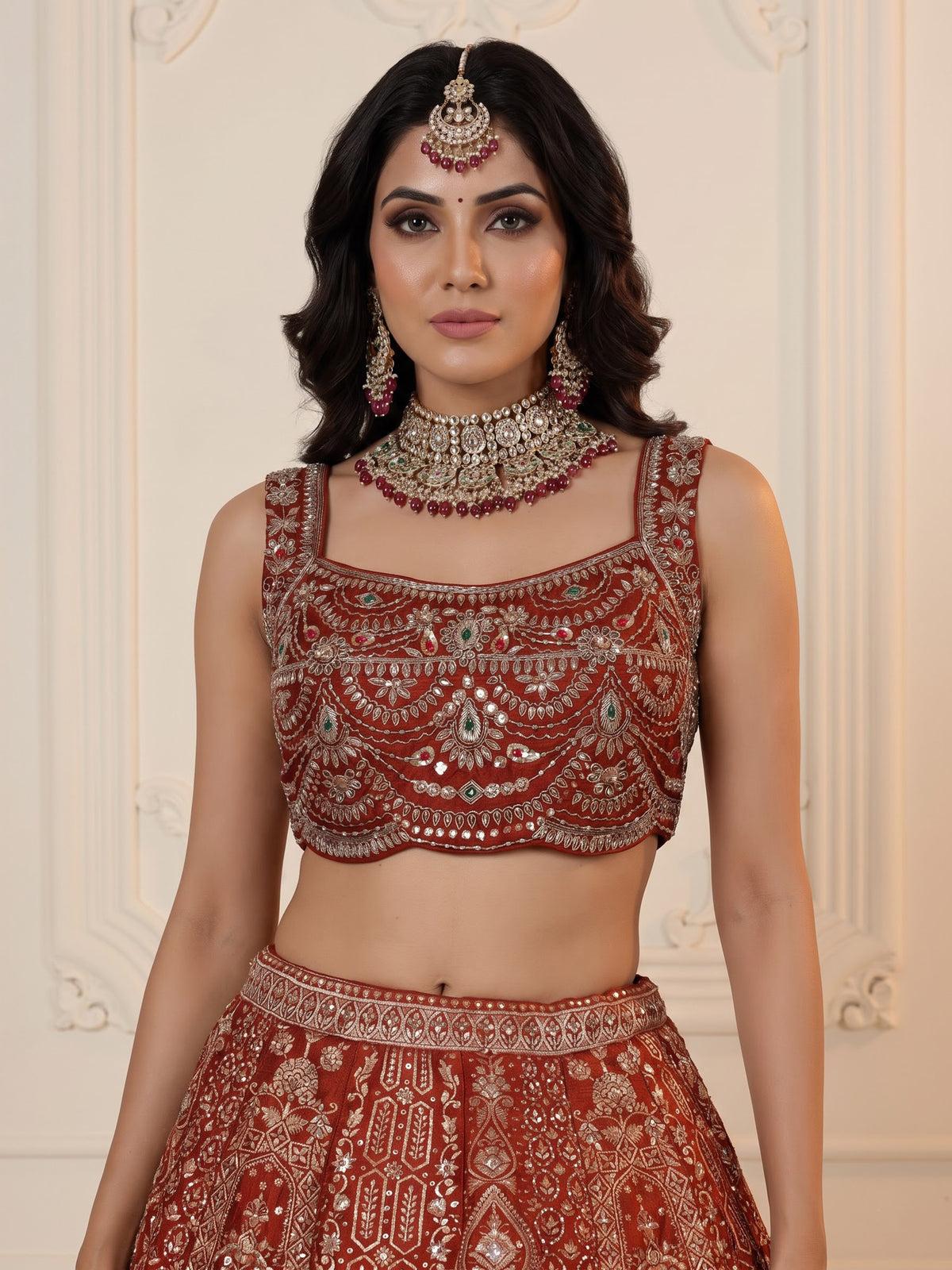 Rust orange silk lehenga choli with mirror and zardosi work