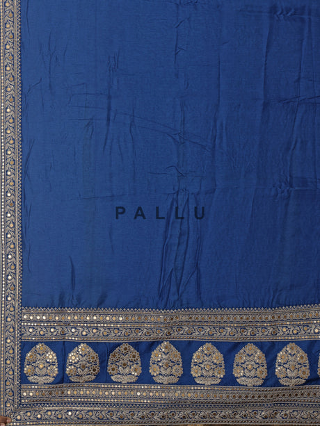 Royal blue silk saree with intricate embroidery and sequin detailing