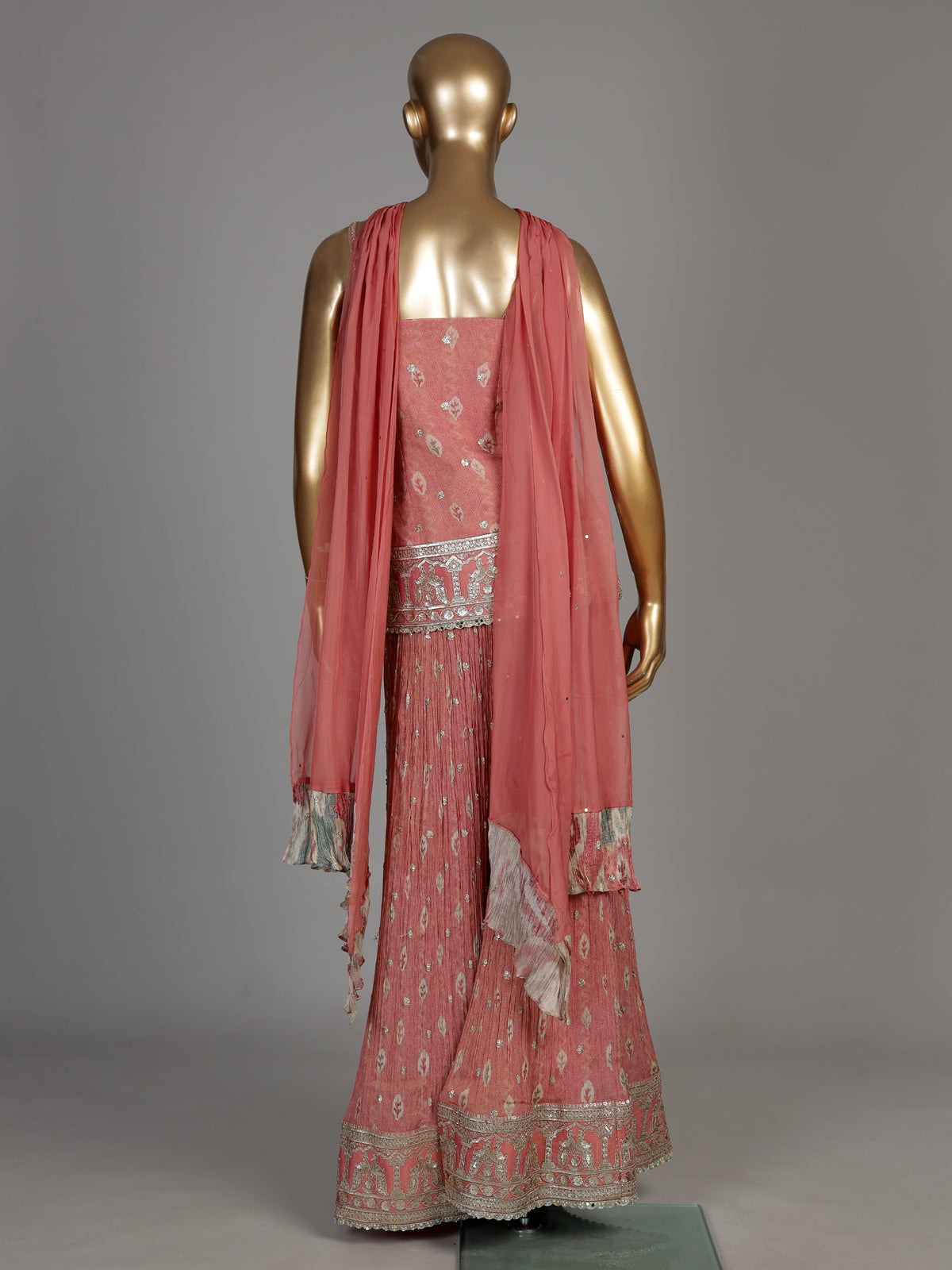 Peach silk palazzo suit with ornate embroidery and dupatta