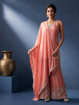 Pastel peach silk palazzo suit with pearl and zari detailing