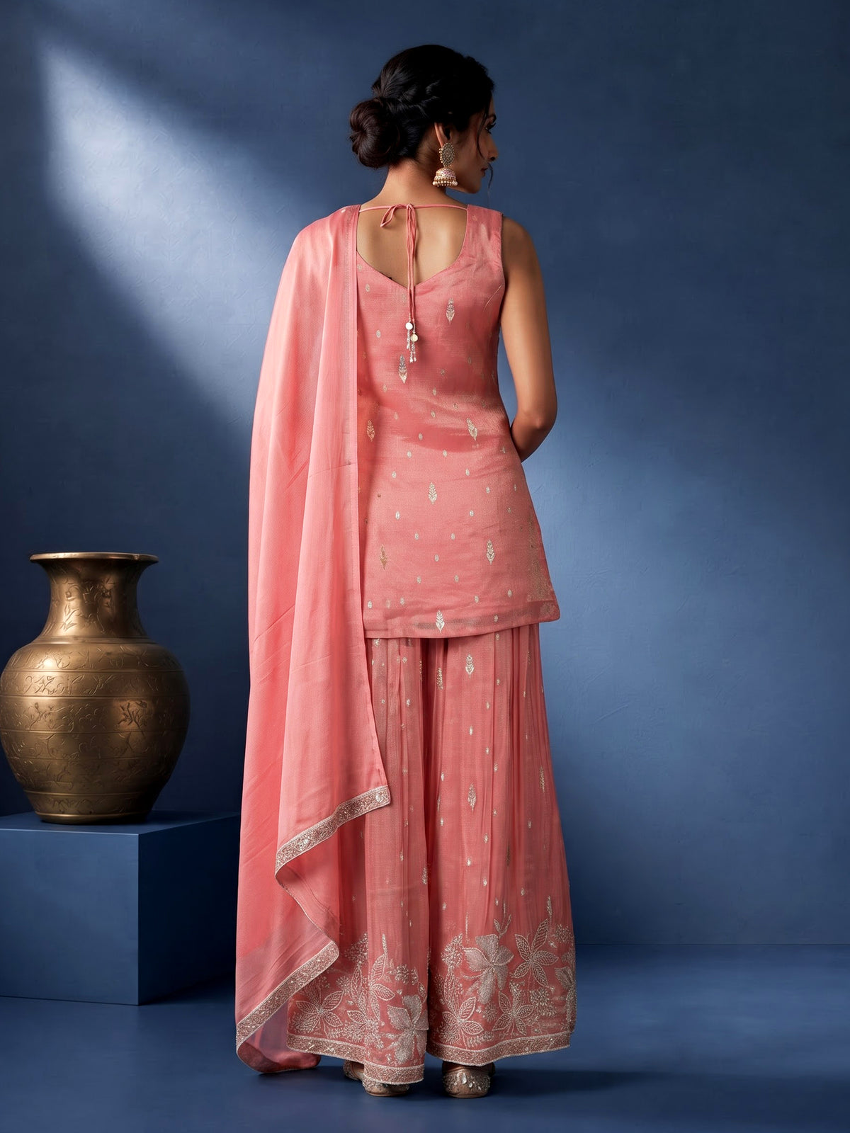 Pastel peach silk palazzo suit with pearl and zari detailing