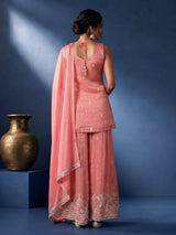 Pastel peach silk palazzo suit with pearl and zari detailing
