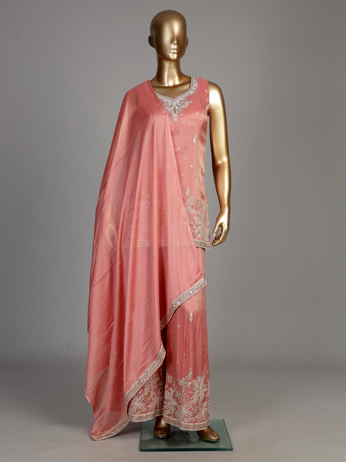 Pastel peach silk palazzo suit with pearl and zari detailing